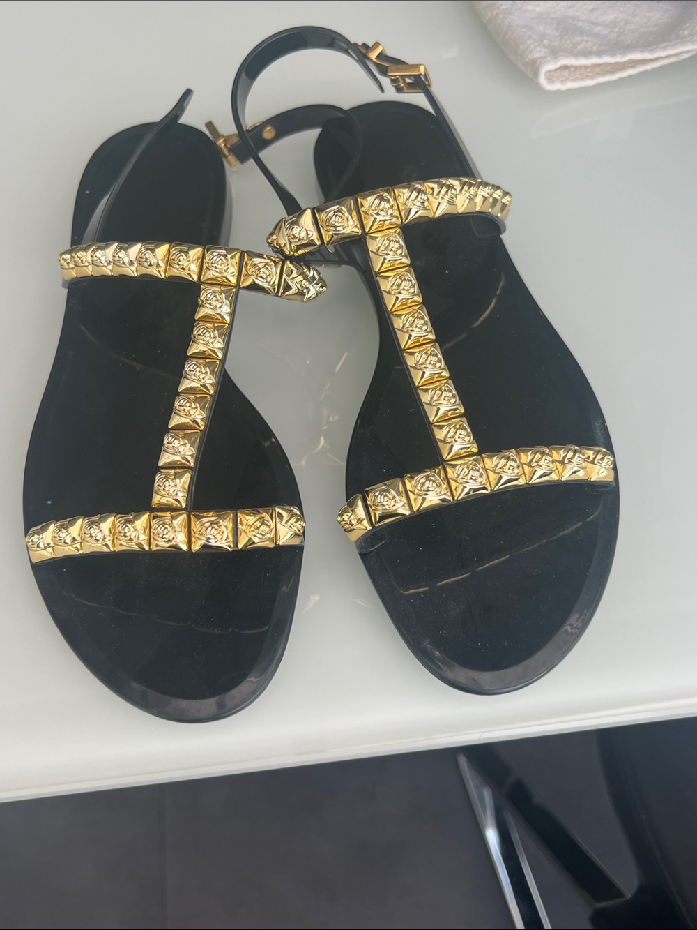 Stuart Weitzman Black Sandals with Gold Pyramid Studs